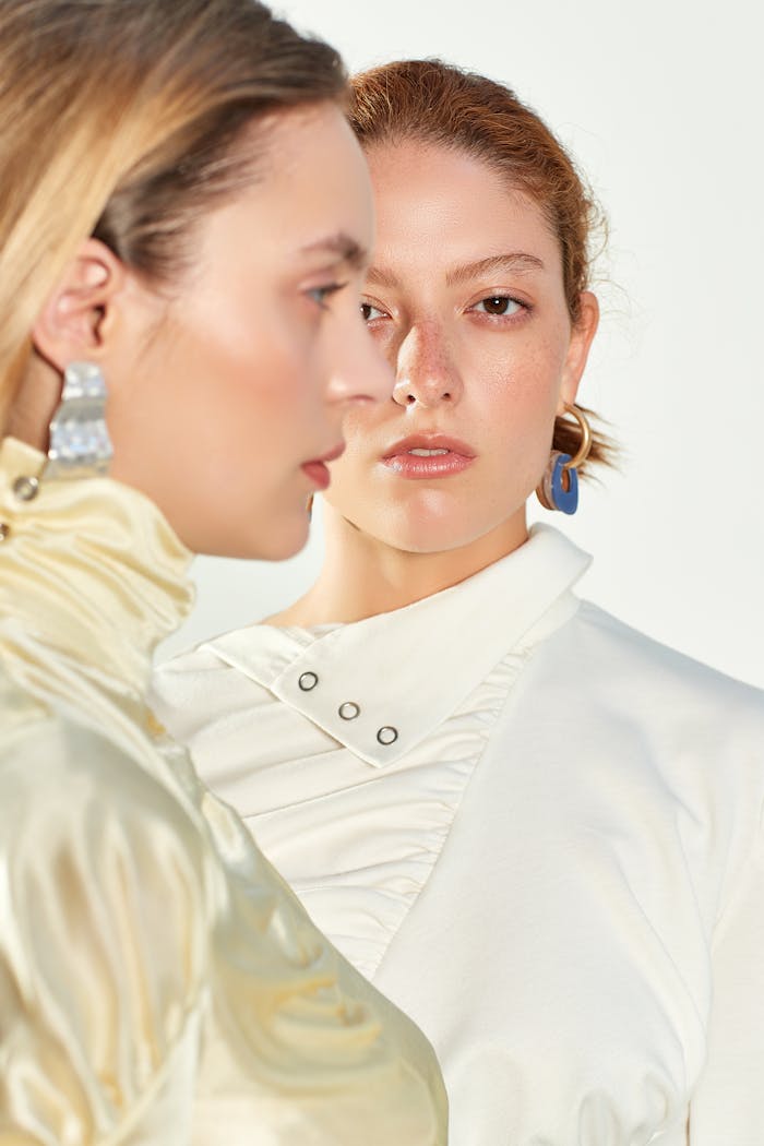 Elegant fashion portrait of two women showcasing modern style in Paris.